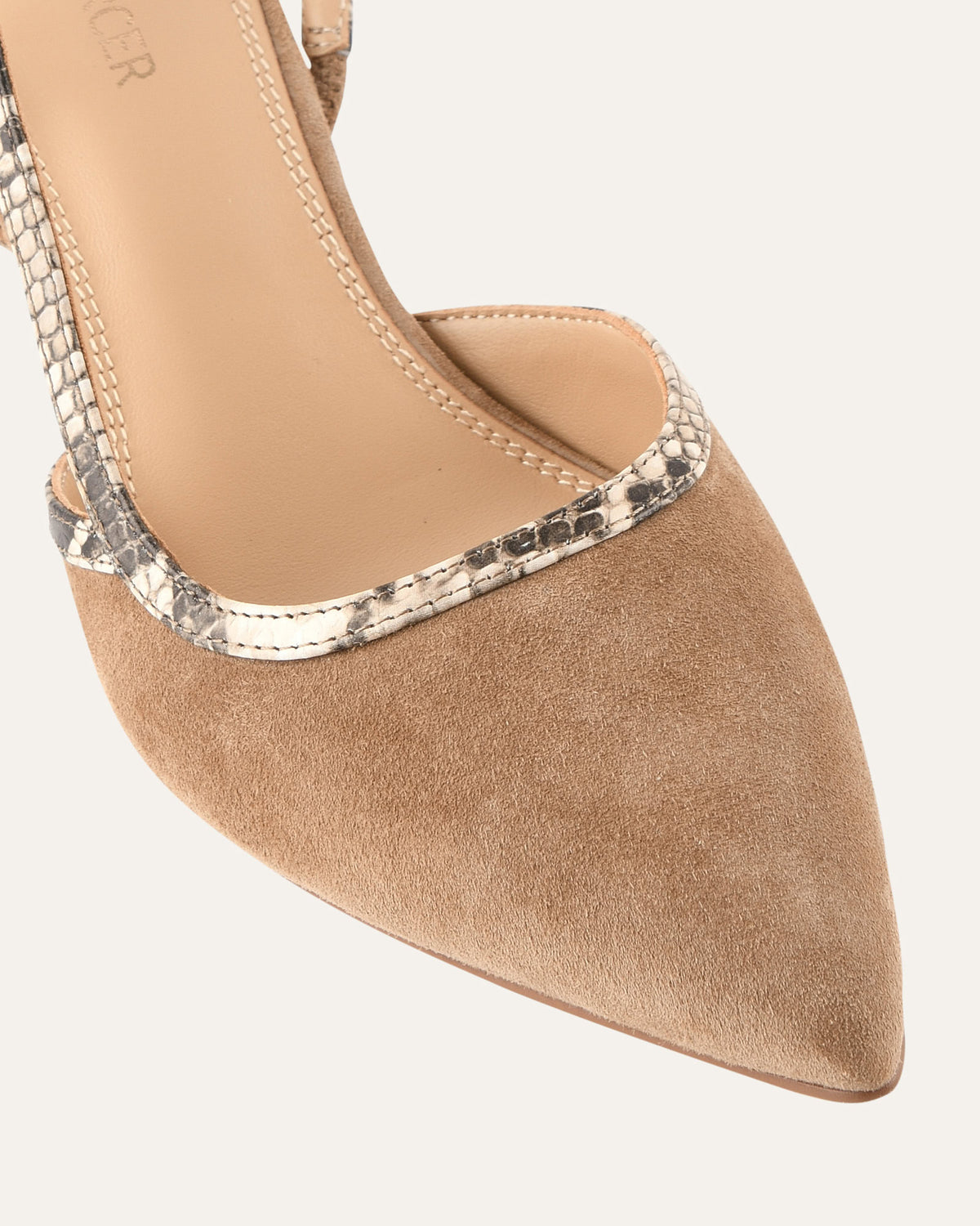 Beige pointed-toe shoe with embellished heel on a white background