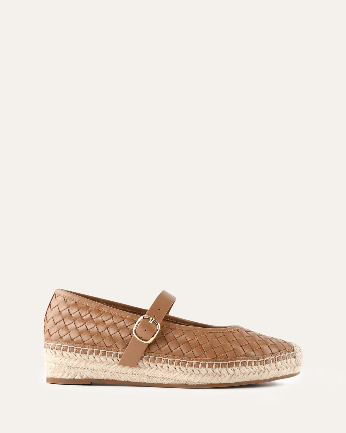 Brown woven espadrille shoe on a white background