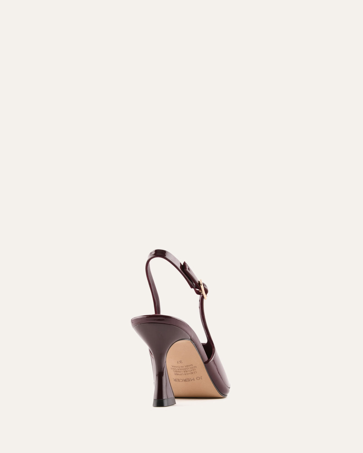 High-heeled shoe on a light beige background