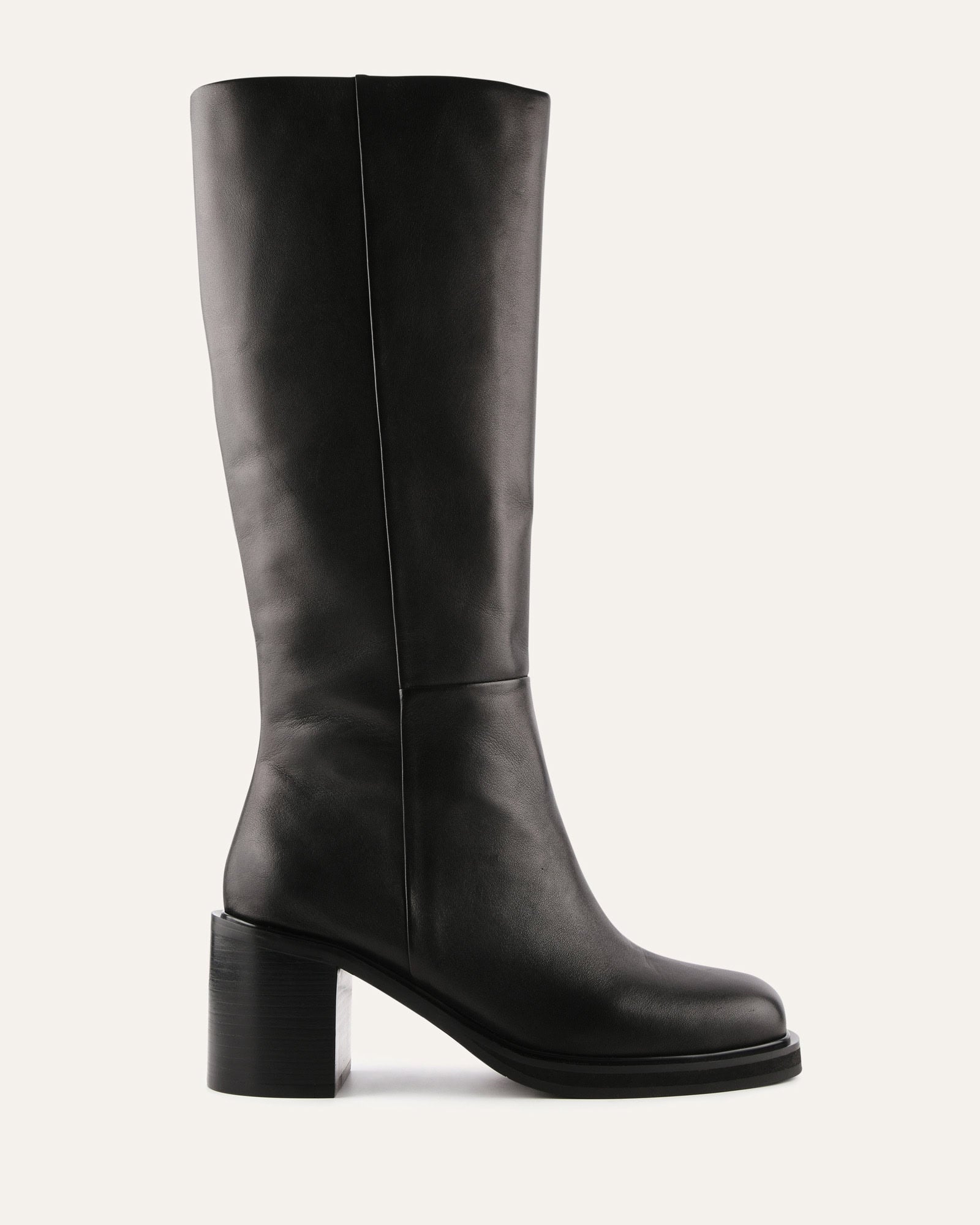 Black knee-high boot on a light gray background