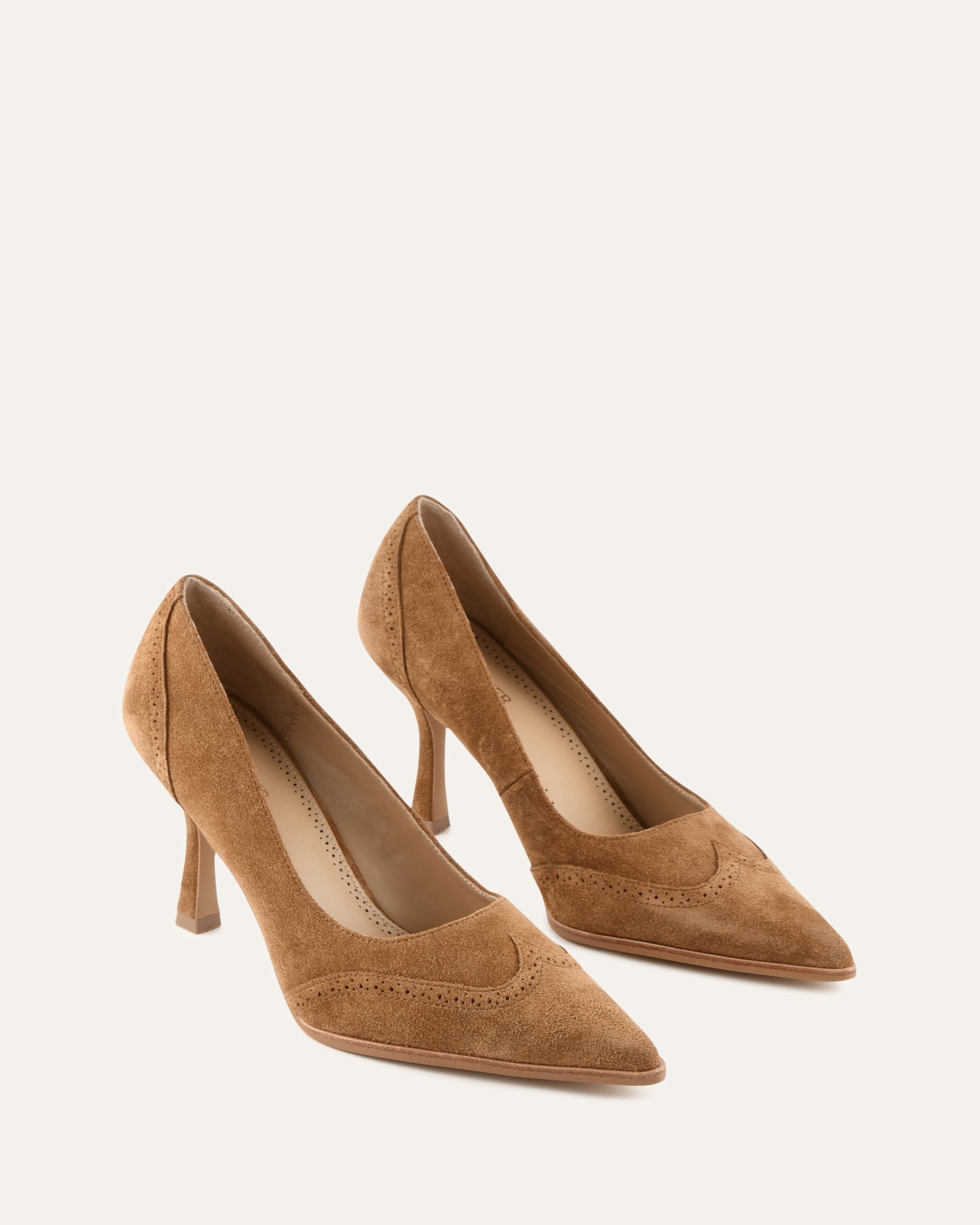Brown suede high heel shoe on a white background