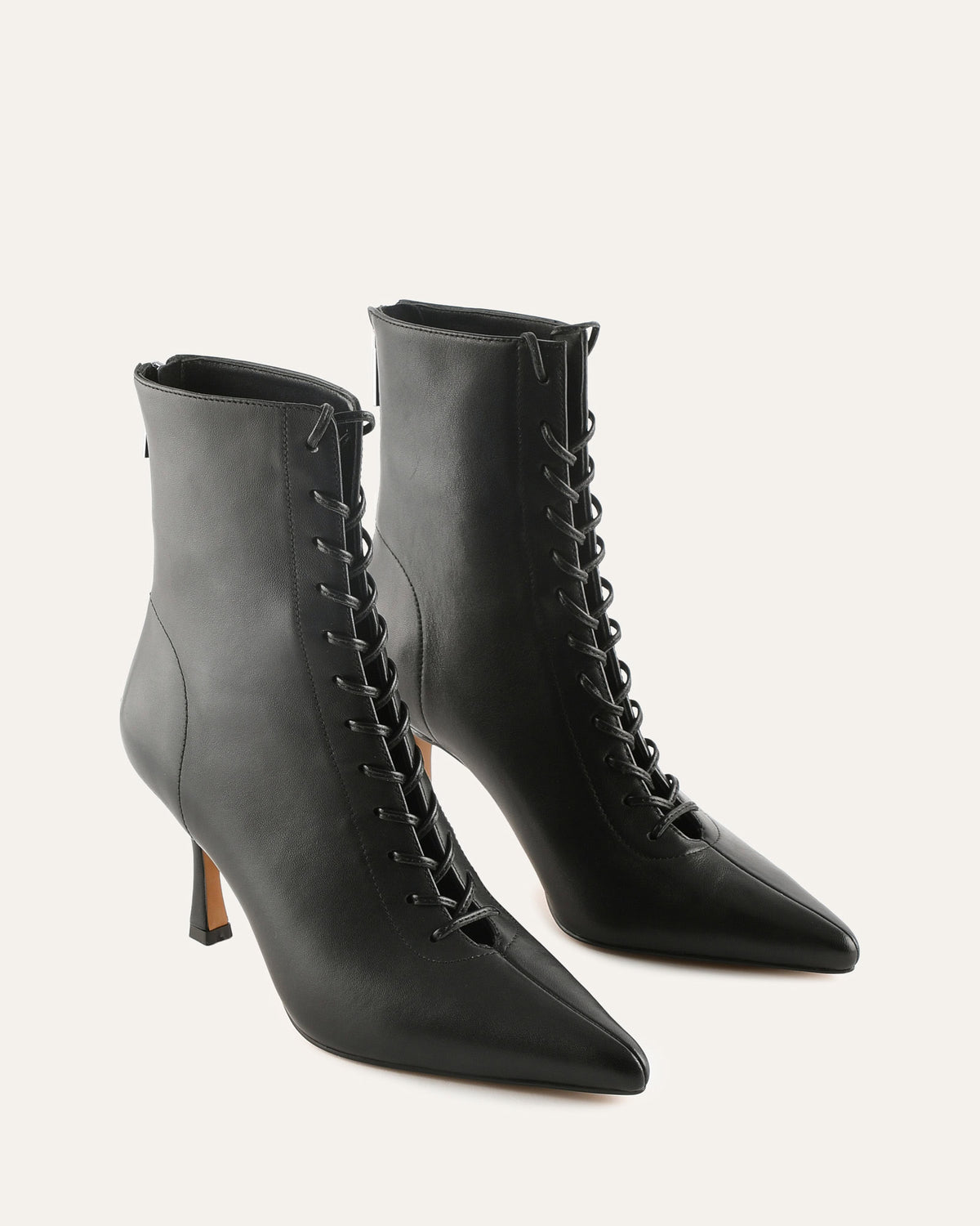 Black leather lace-up ankle boots on a white background