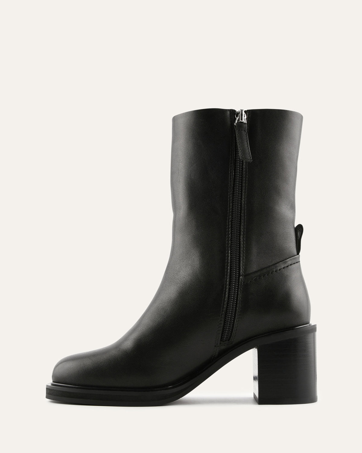 Black leather ankle boot with a block heel on a white background
