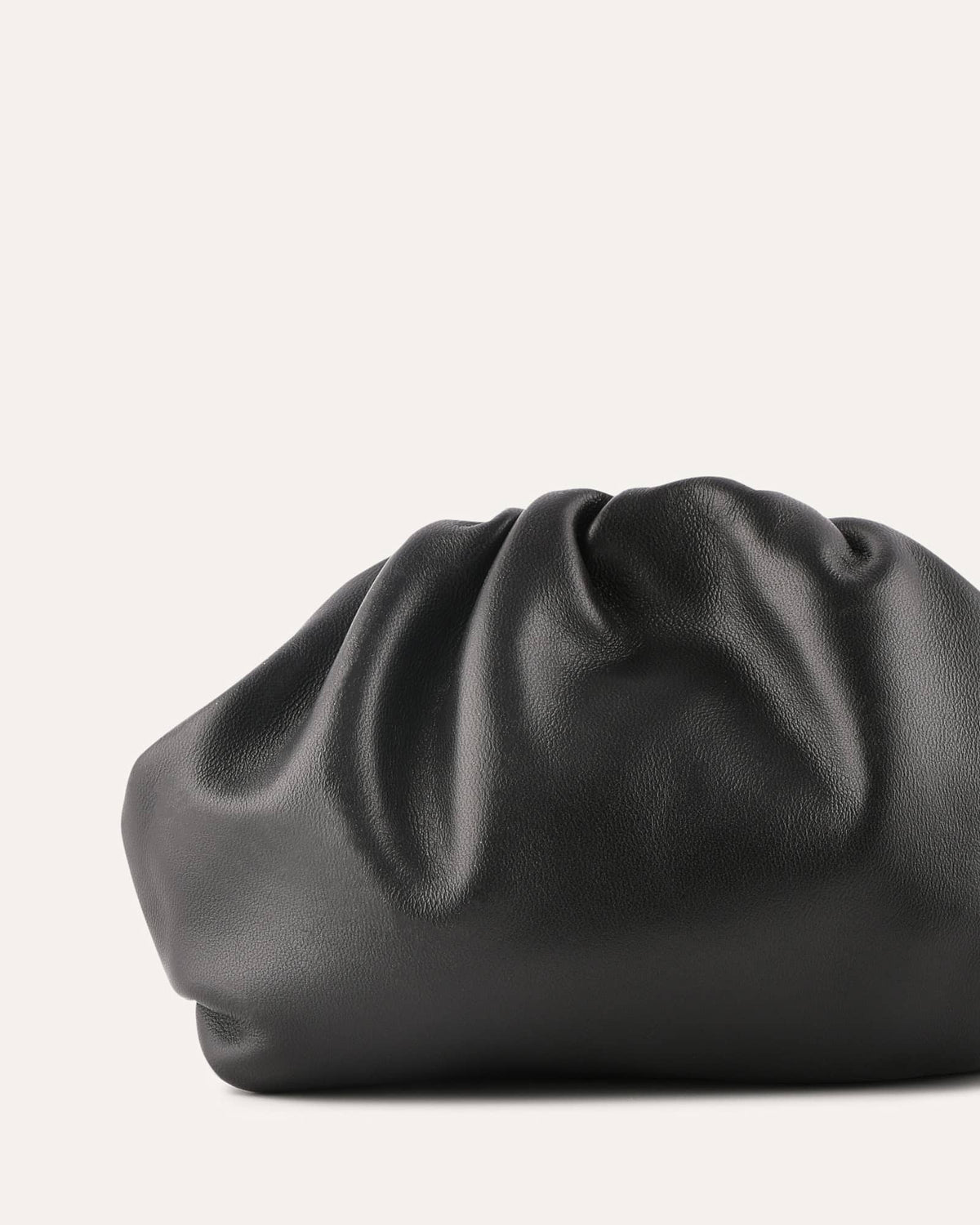 Black leather clutch bag on a light gray background