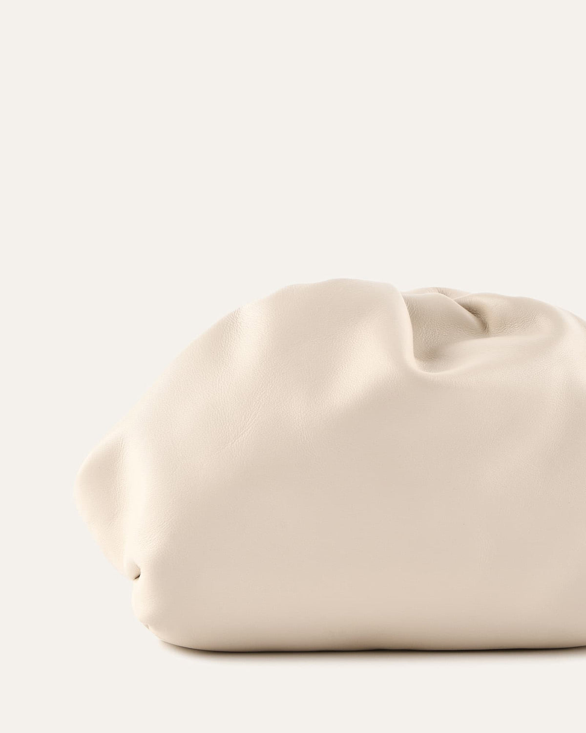 Beige handbag on a white background