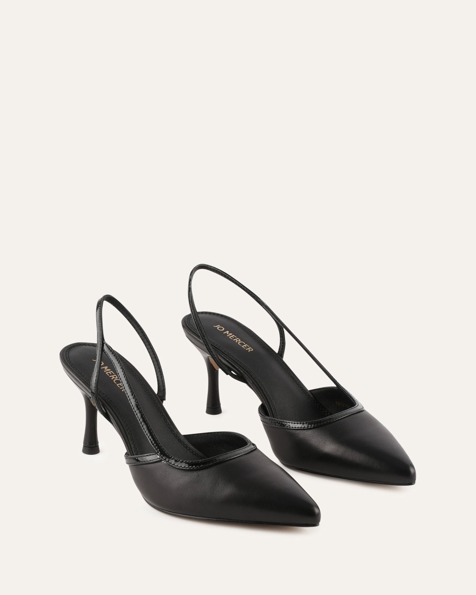 Black slingback shoe on a light gray background