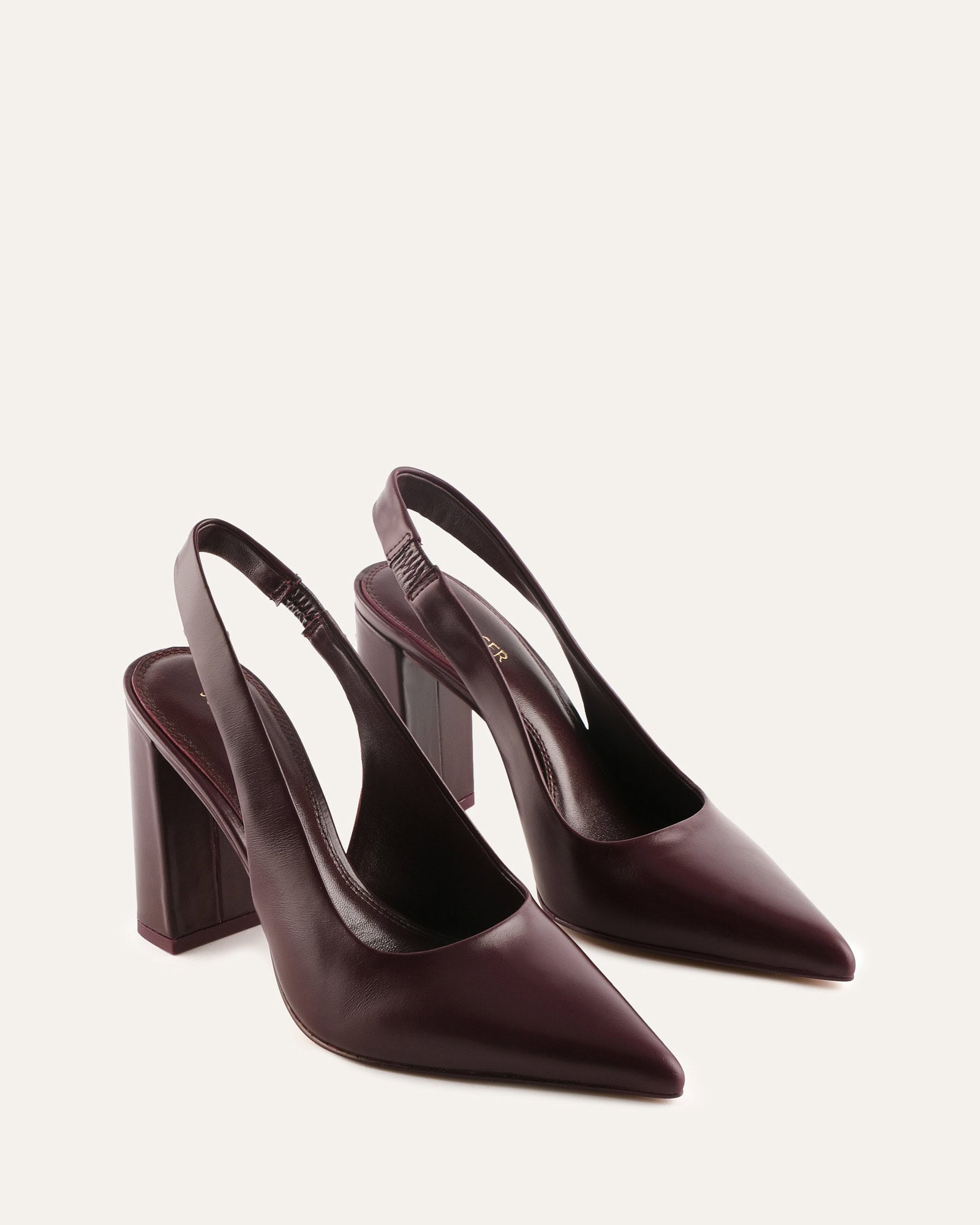 Black high-heeled shoes on a white background