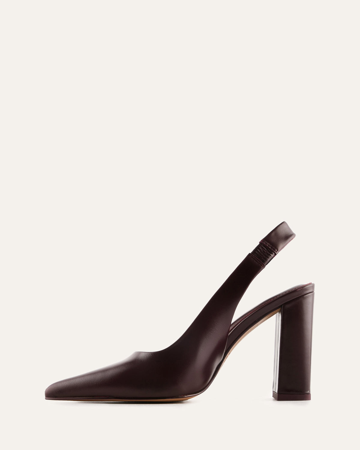 Brown high-heeled shoe on a light gray background