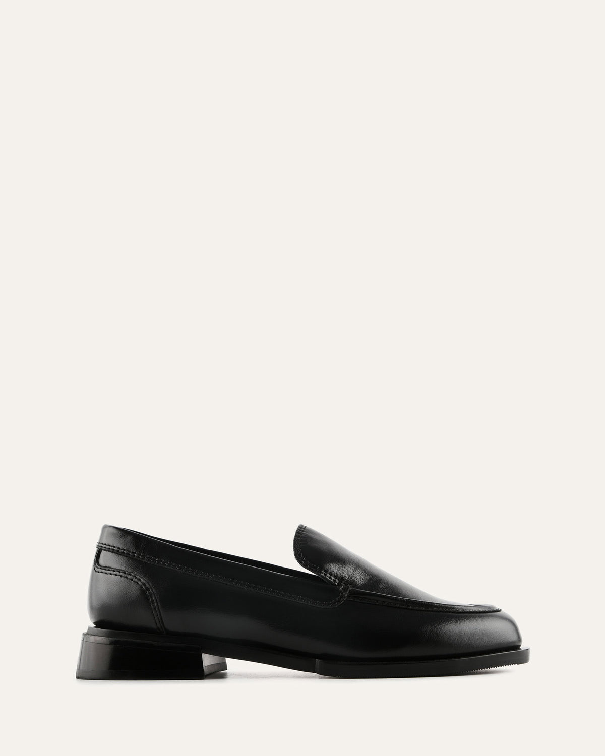 Black loafers on a white background