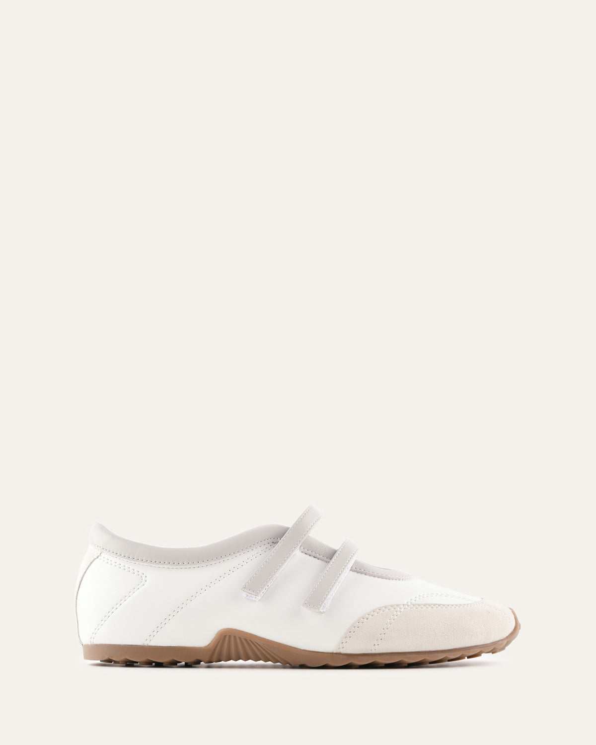 White shoe with a strap on a light gray background