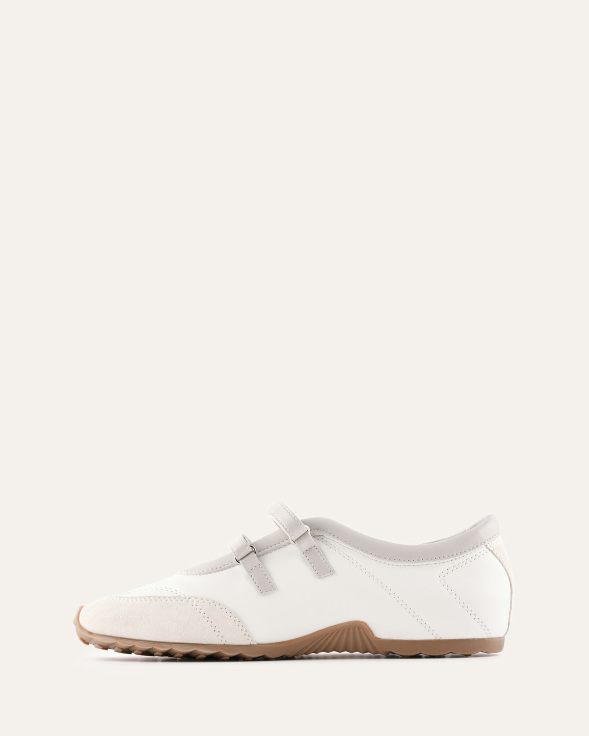 White shoe with a brown sole on a white background
