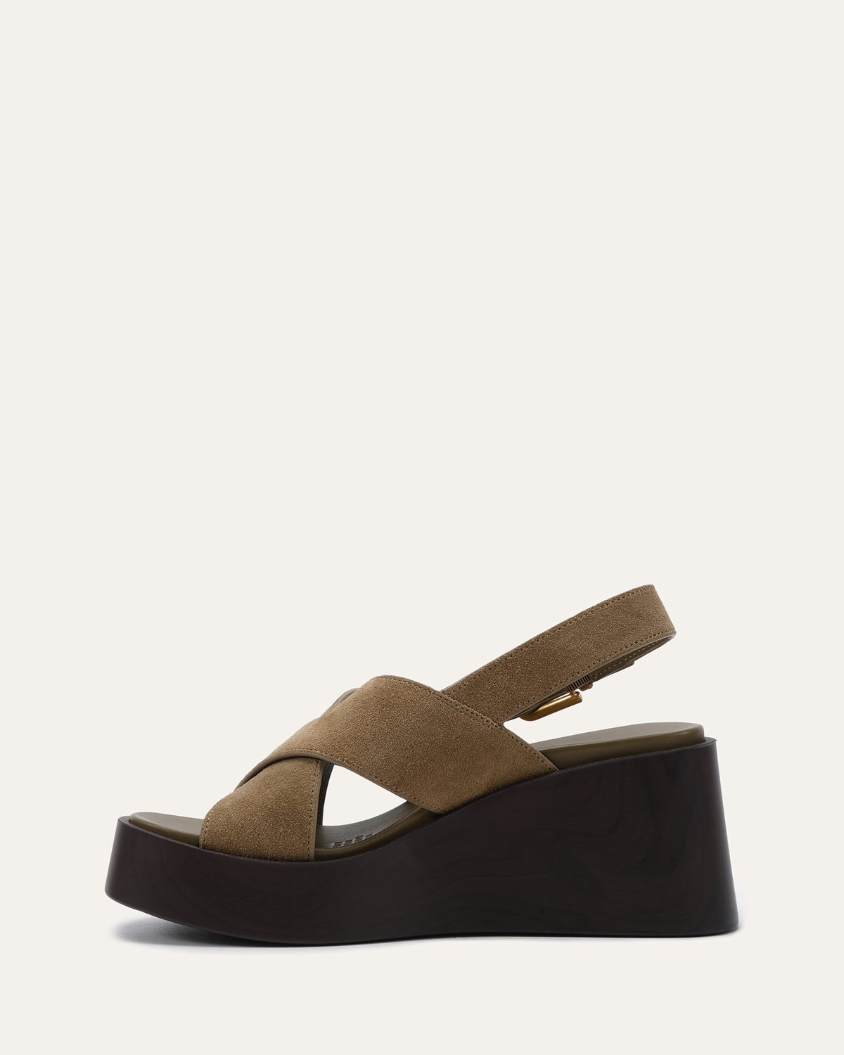A single platform wedge sandal in taupe suede with a thick black platform sole, shown from a side profile against a light off-white background.