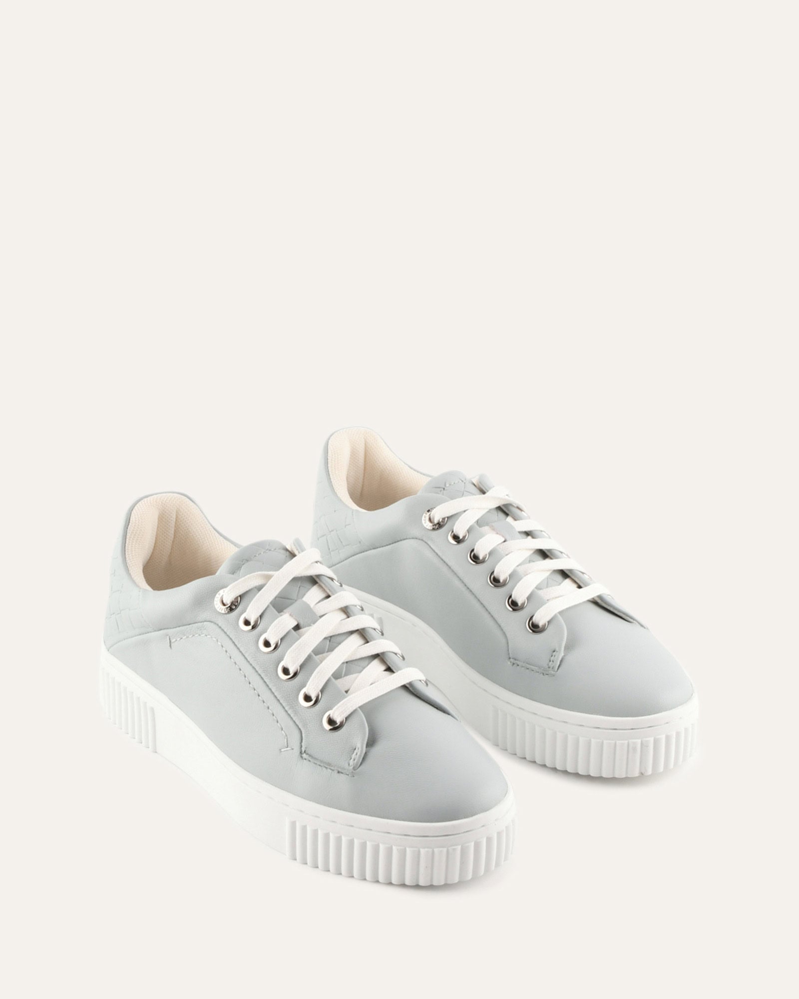 Light gray sneaker with white sole on a white background