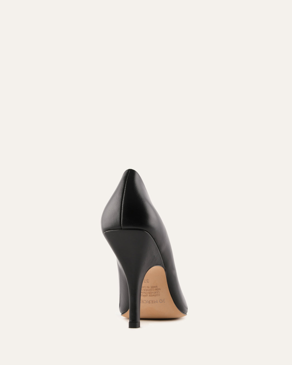 Black high-heeled shoe on a light gray background