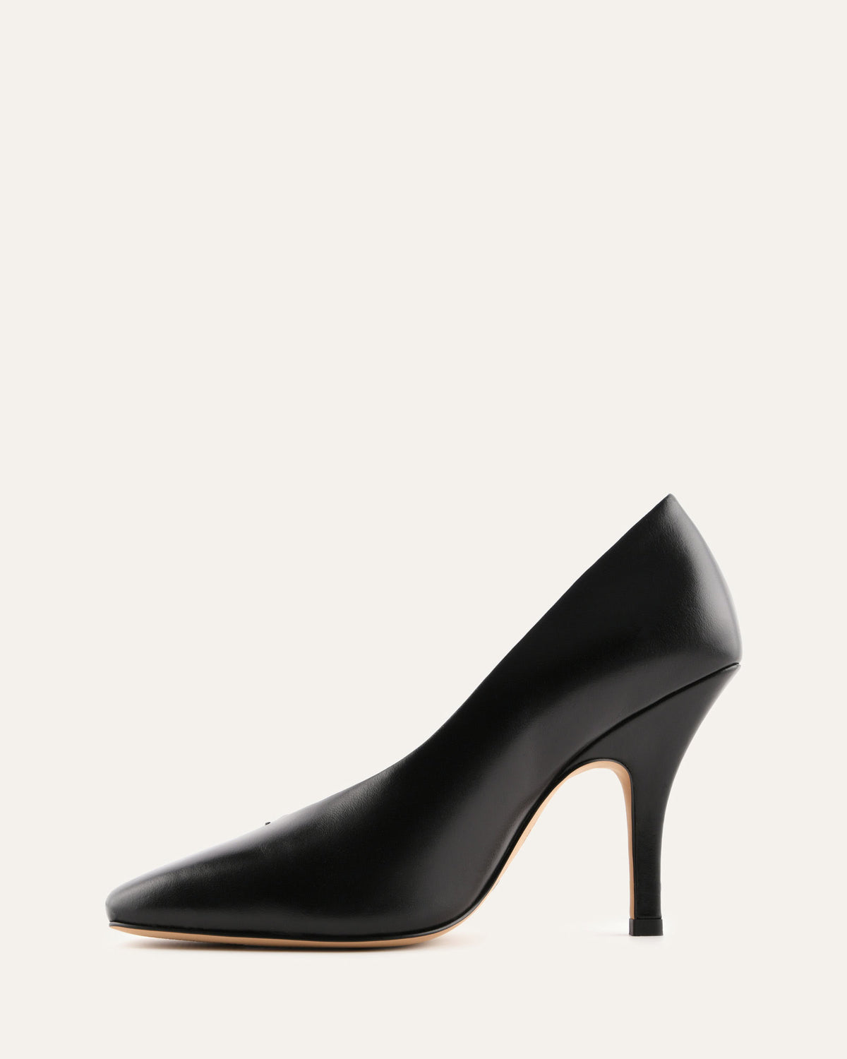 Black high-heeled shoe on a light gray background