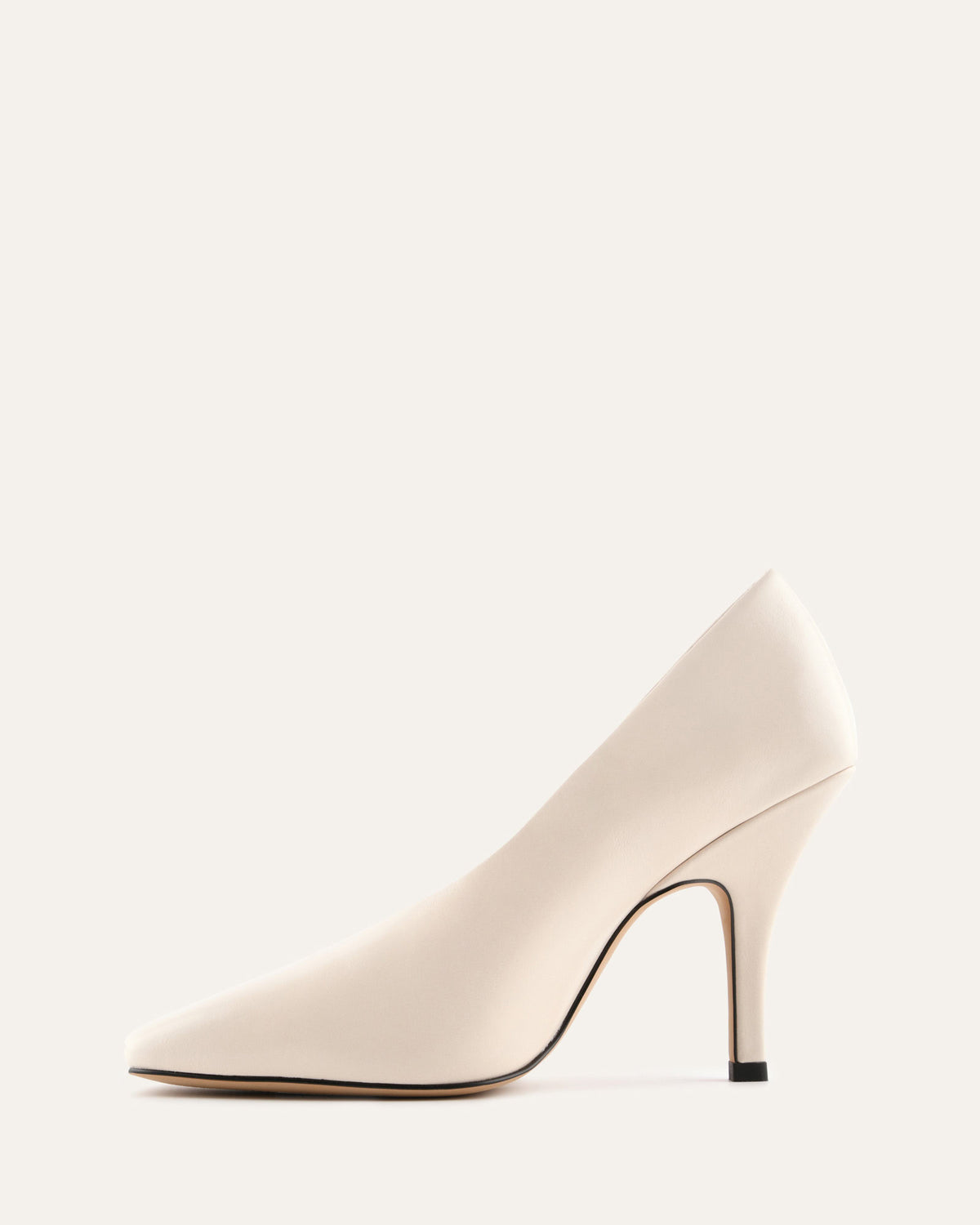 Beige high-heeled shoe on a white background
