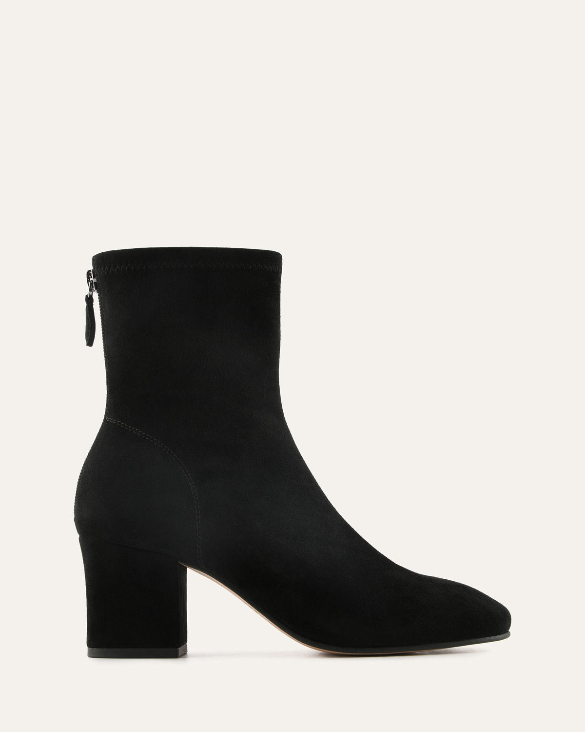 Black ankle boot on a light gray background