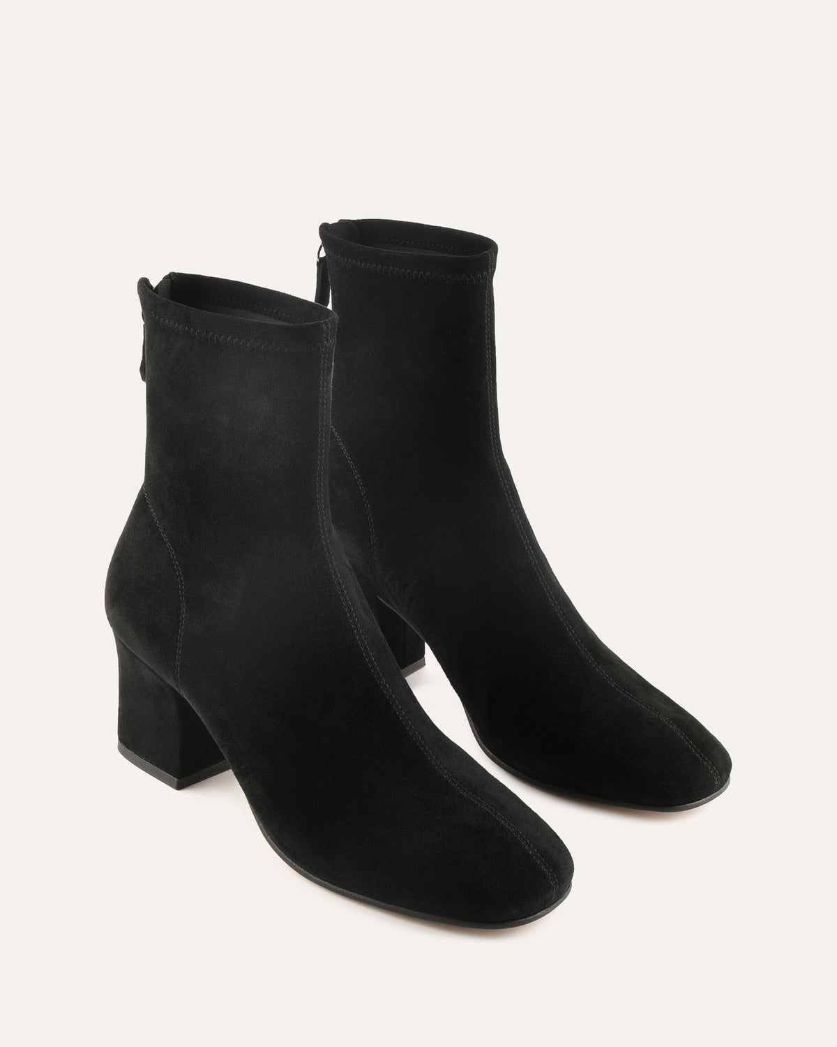 Pair of black ankle boots on a white background