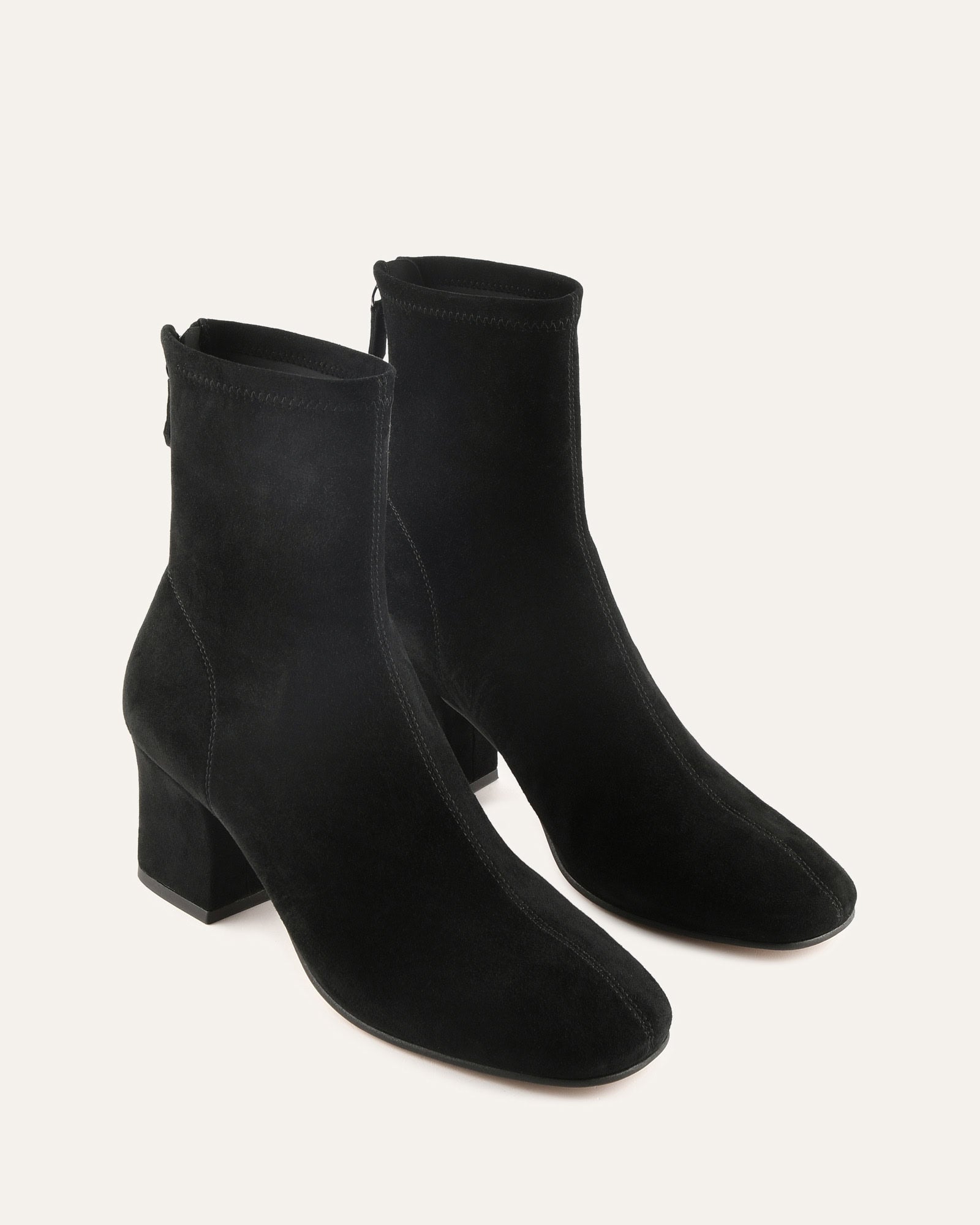 Black ankle boot on a light gray background