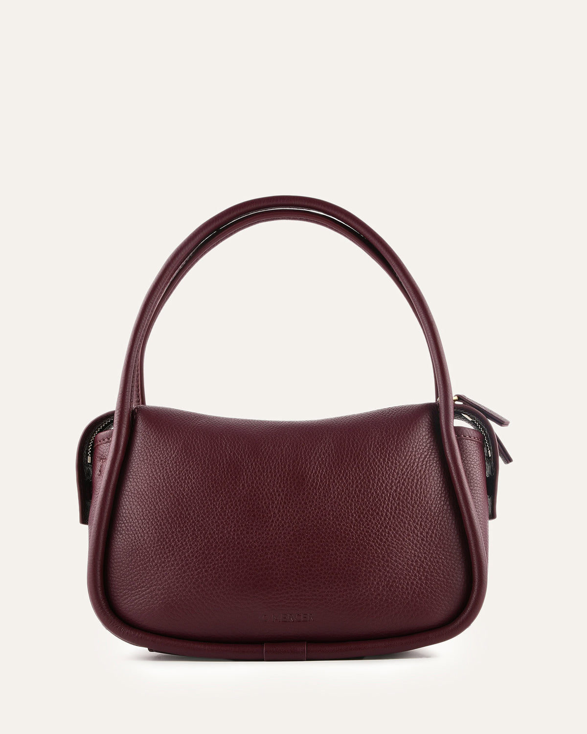 Burgundy handbag on a light beige background