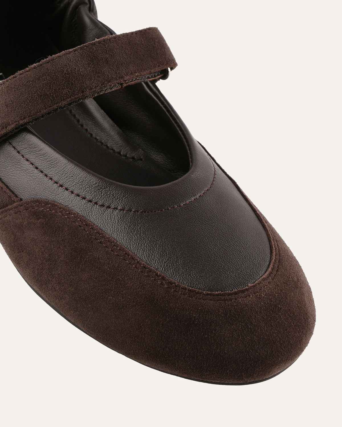 Brown shoe with a strap on a white background