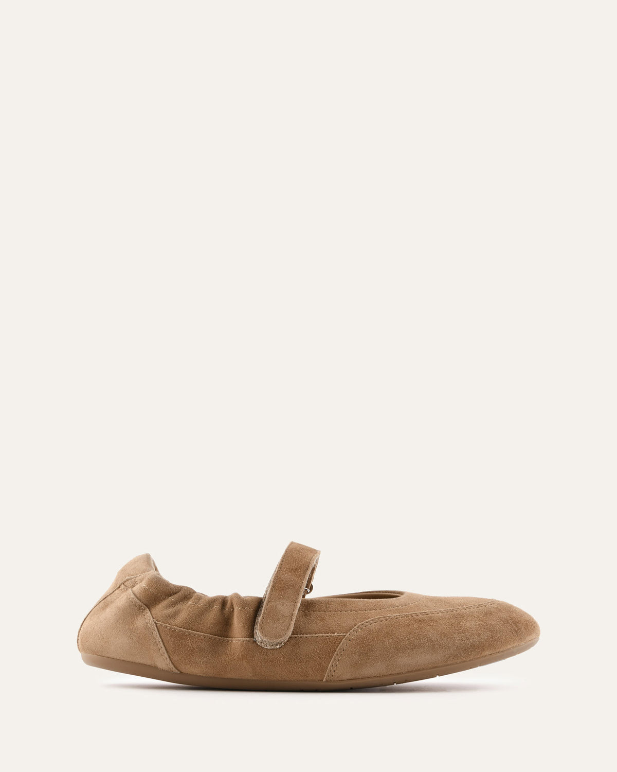 Brown suede flat shoe on a white background