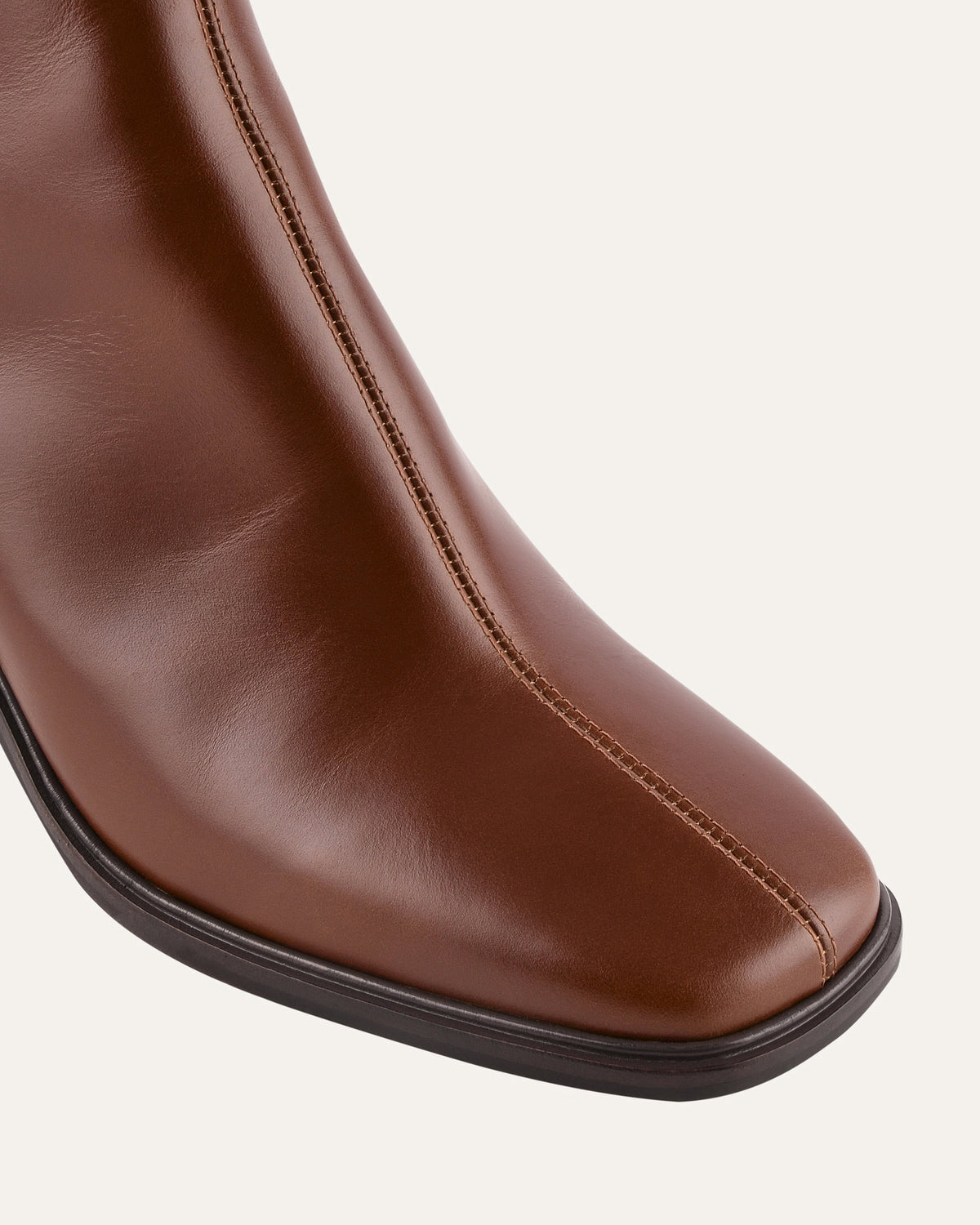 Brown leather shoe on a white background