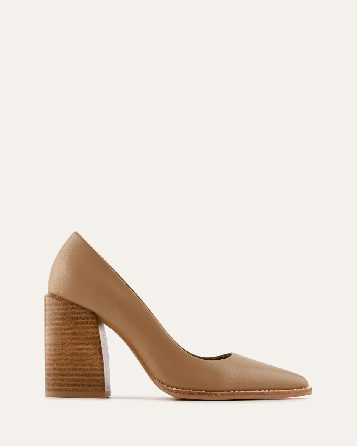 Tan high-heeled shoe on a light beige background