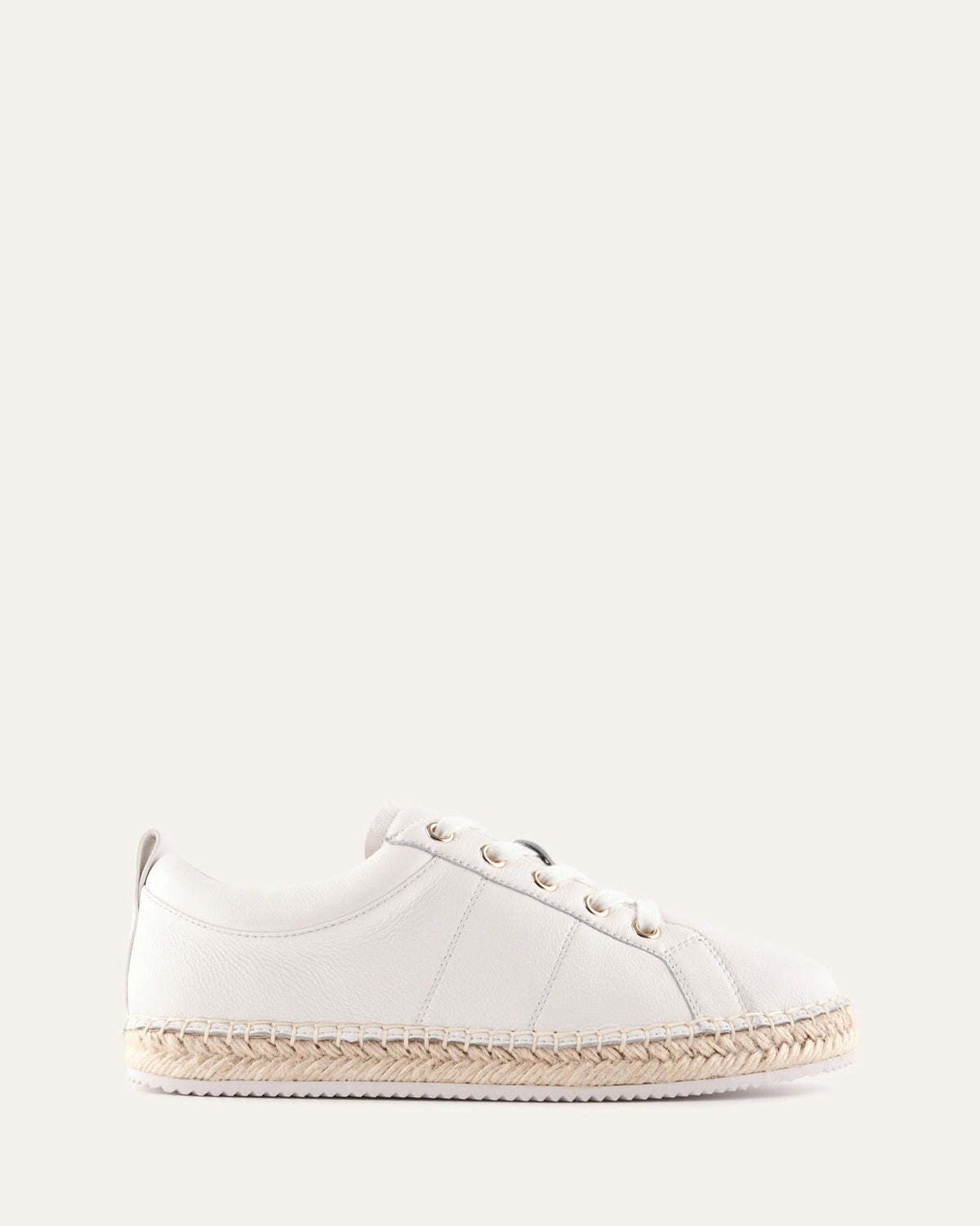 White sneaker with a woven sole on a white background
