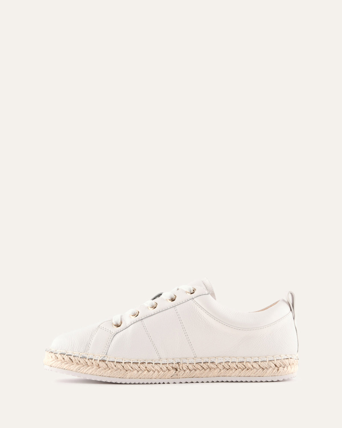 White sneaker with a woven sole on a white background