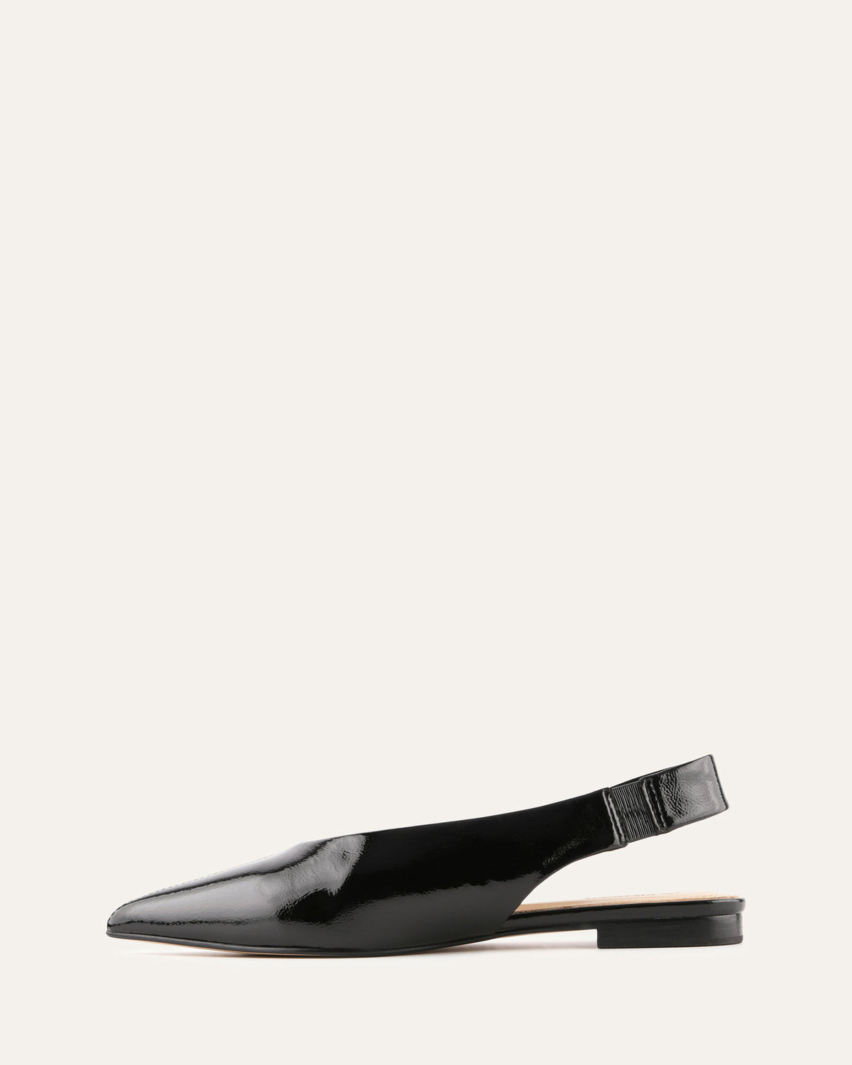 Black patent leather slingback flat shoe on a white background