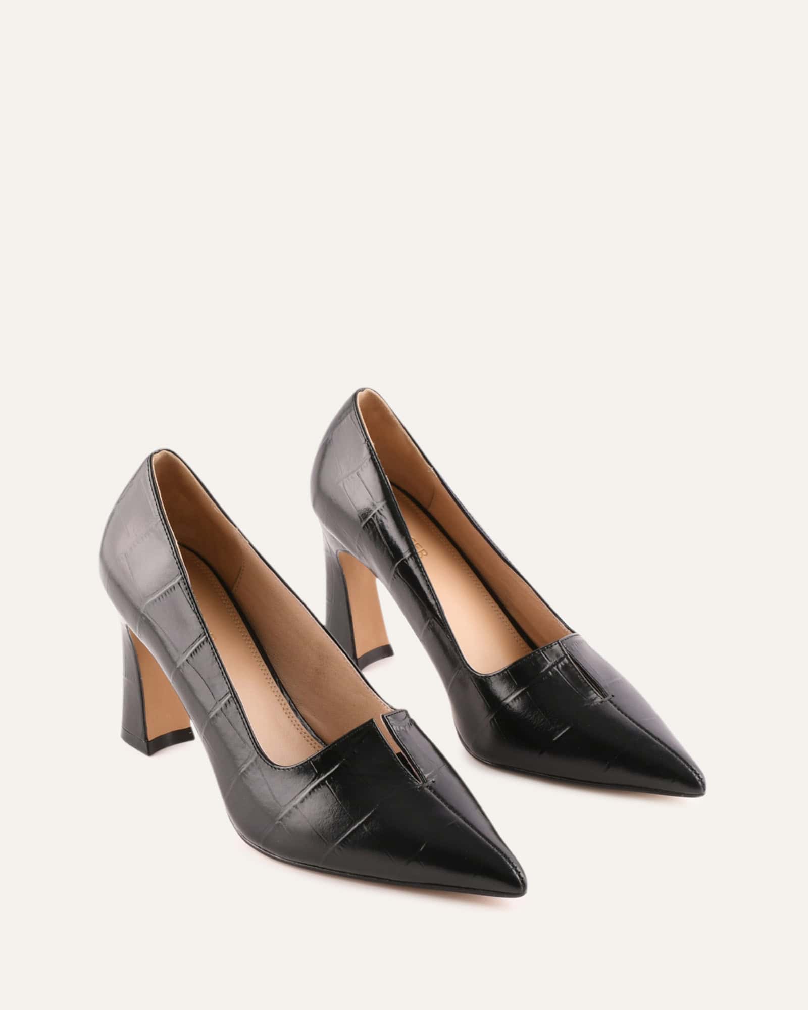 Black high-heeled shoe on a white background