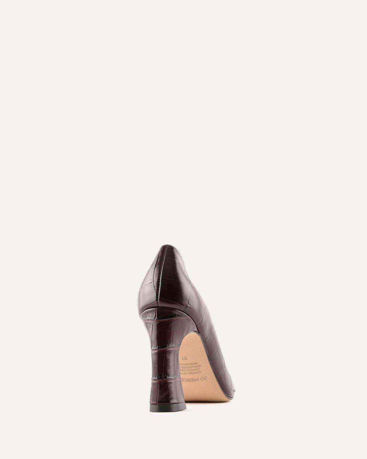 Brown high-heeled shoe on a white background
