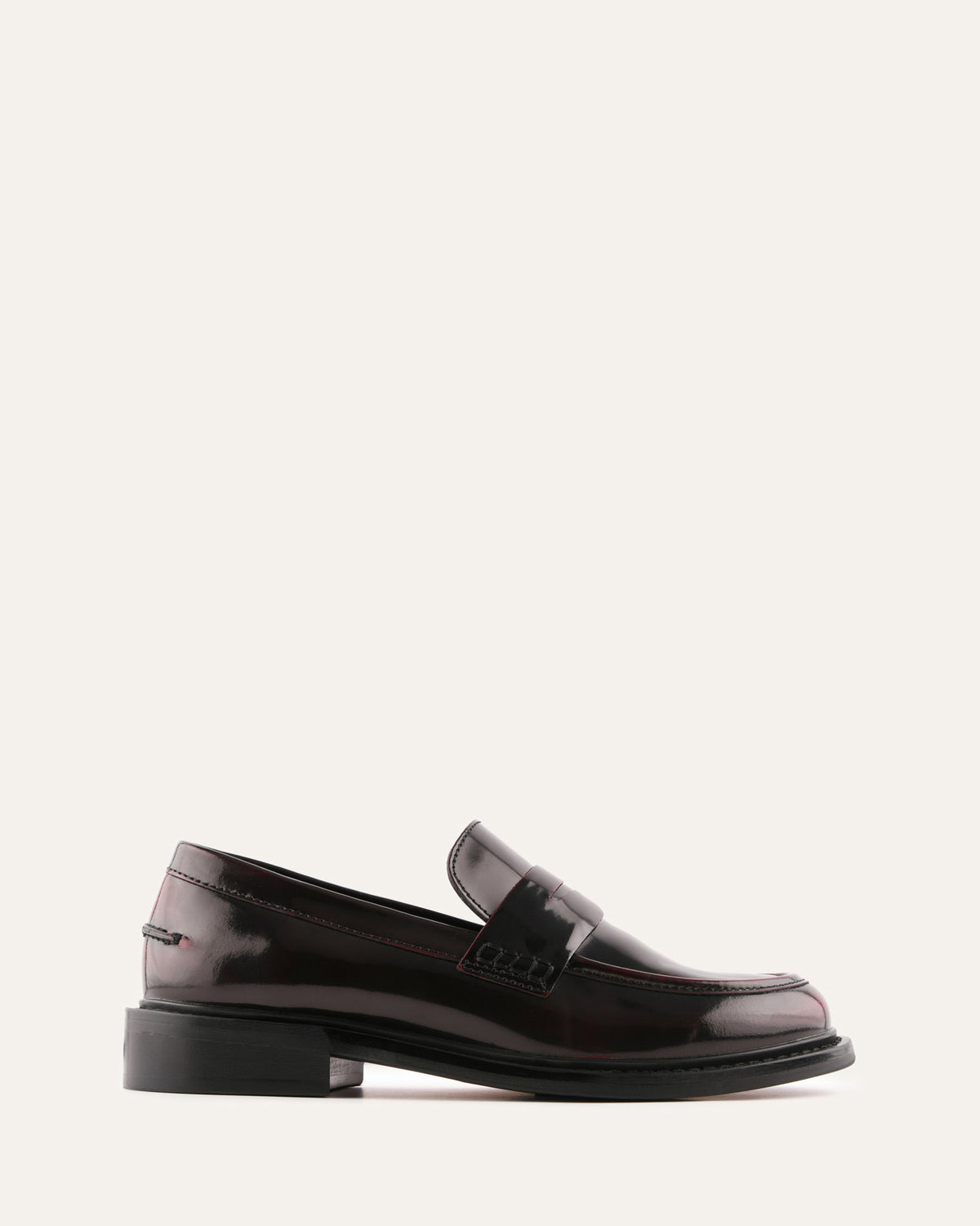 Shiny black loafer on a white background