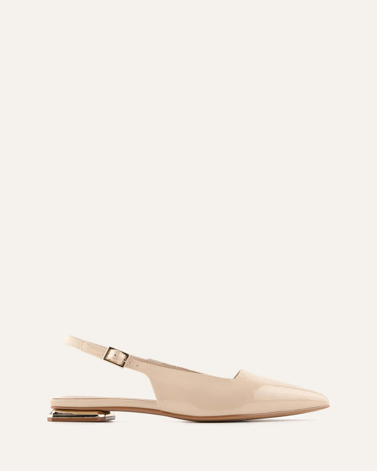 Beige slingback flat shoe on a white background