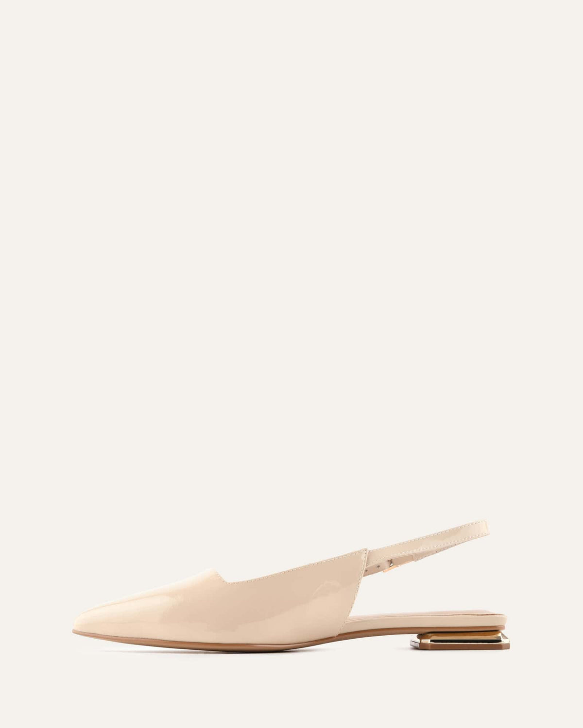 Beige slingback shoe on a white background
