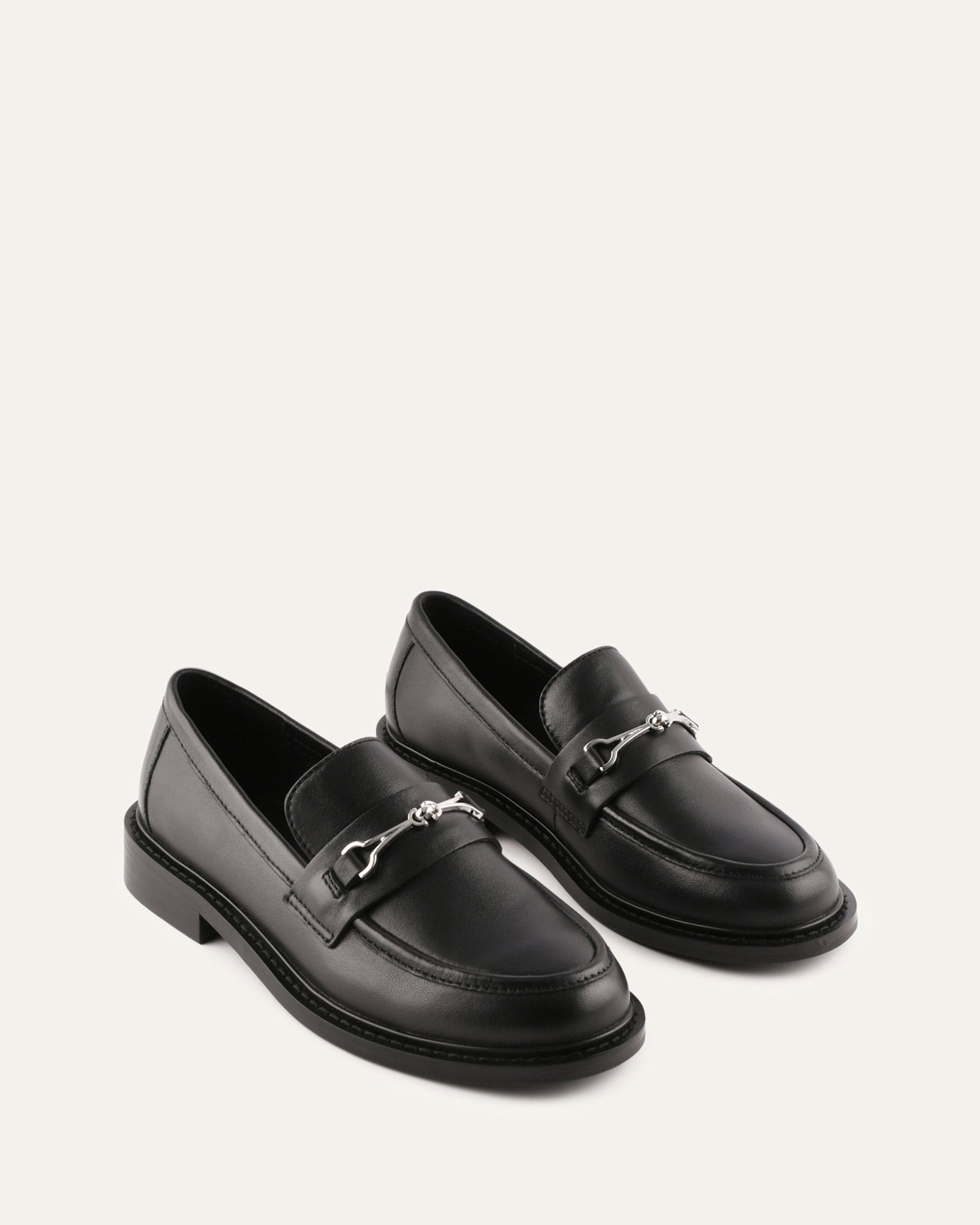 Black loafer shoe on a white background