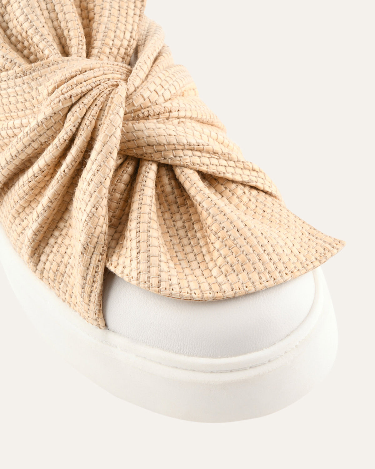 Beige knotted headband on a white background