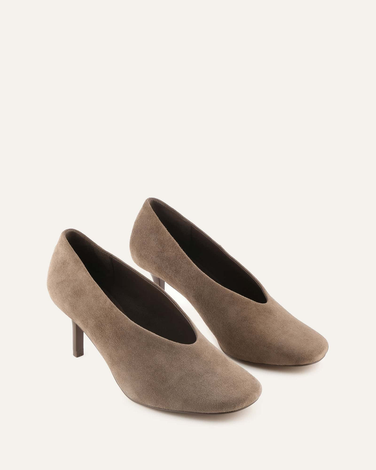 Pair of brown high-heeled shoes on a white background