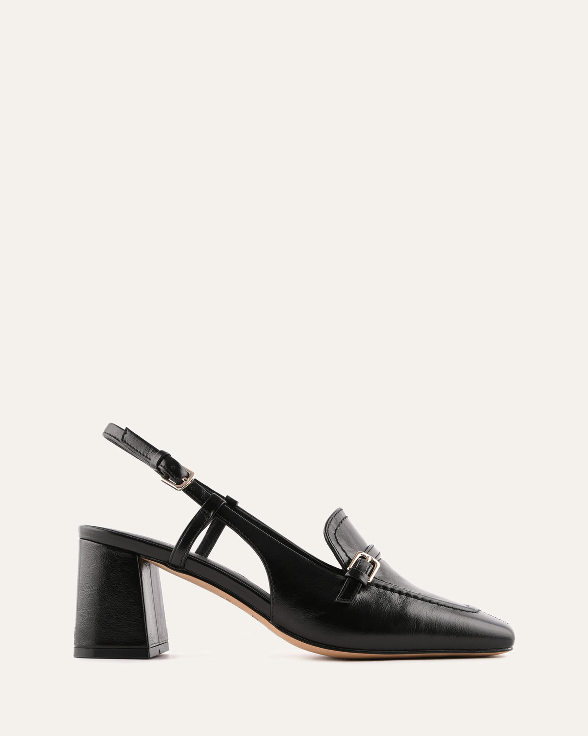 Black loafer with a block heel on a white background