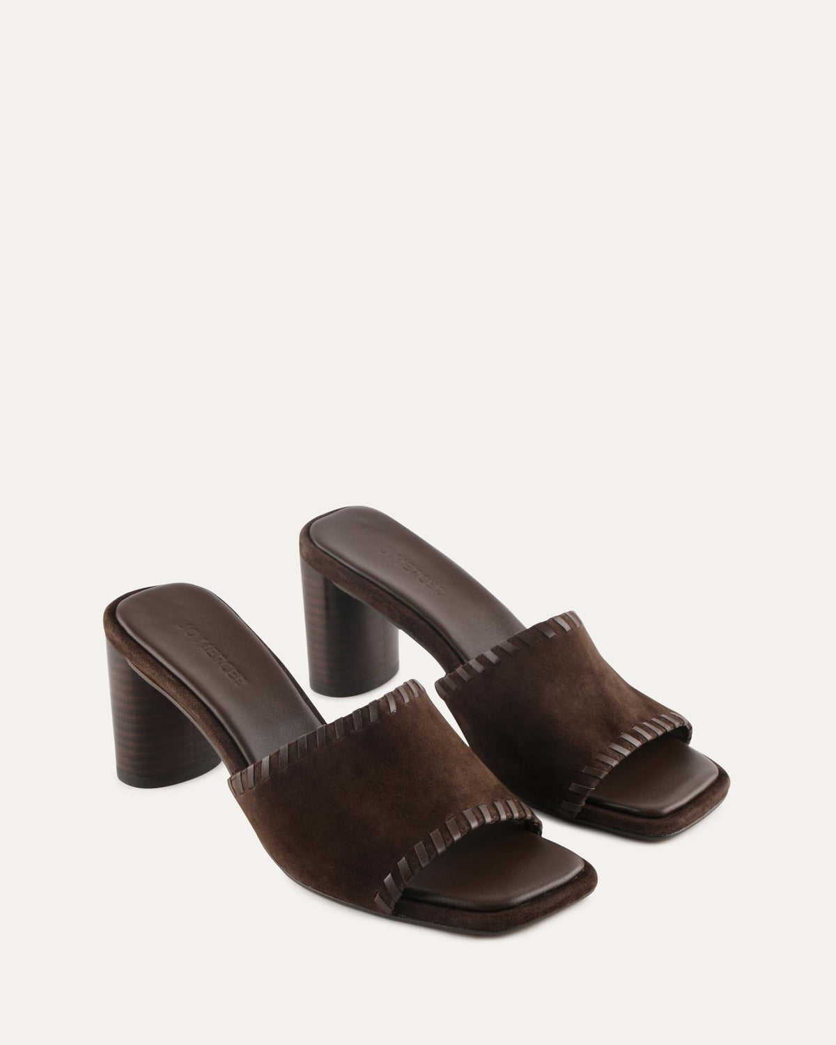 Brown suede high-heeled sandals on a white background