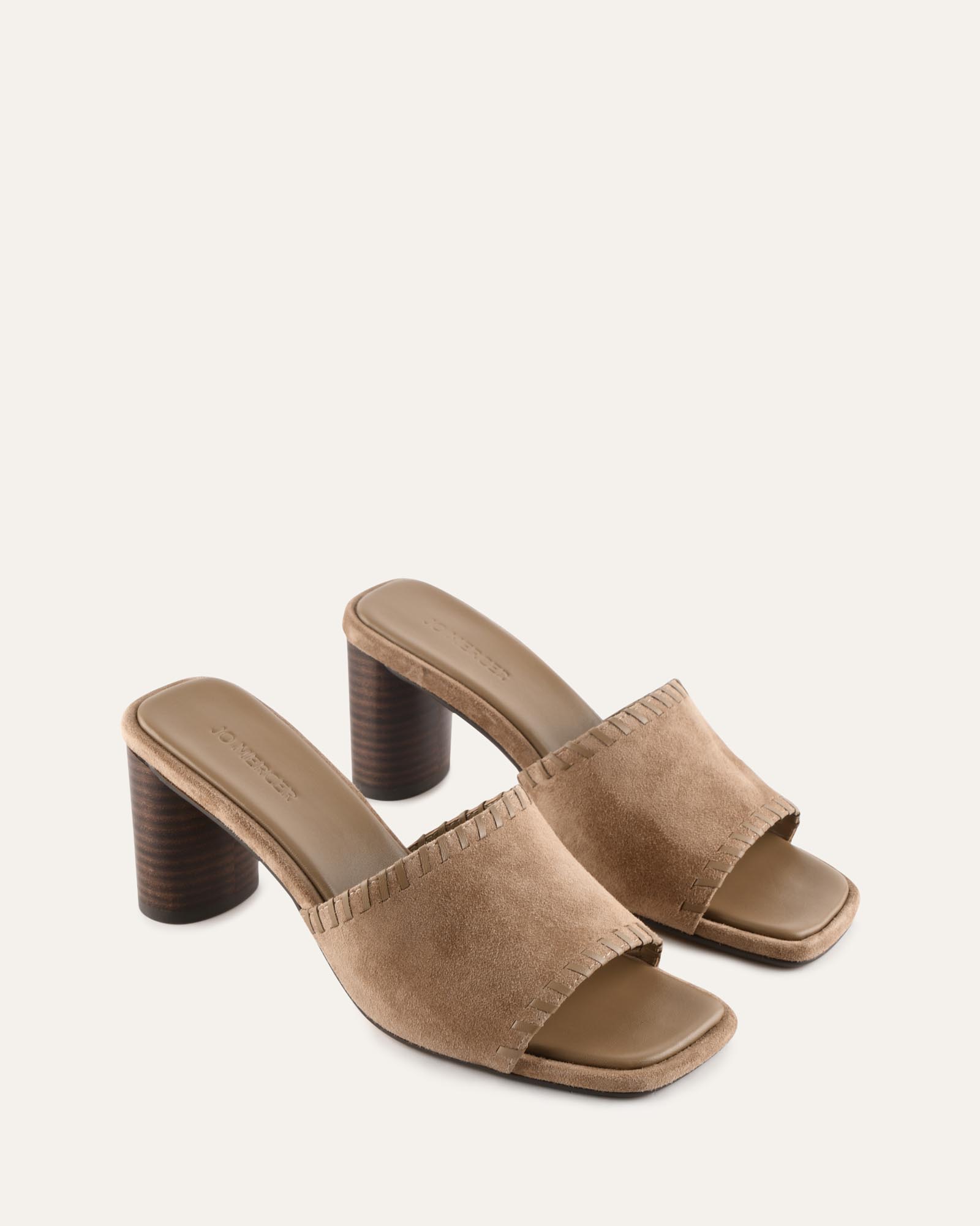 Brown sandal with a block heel on a white background