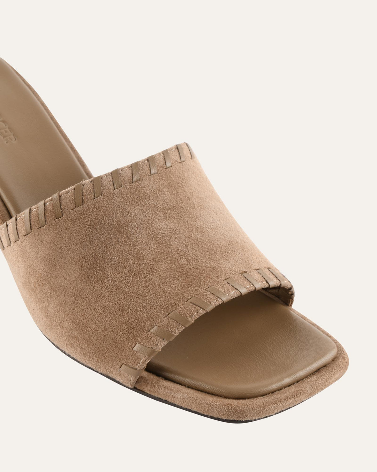 Beige sandal on a white background
