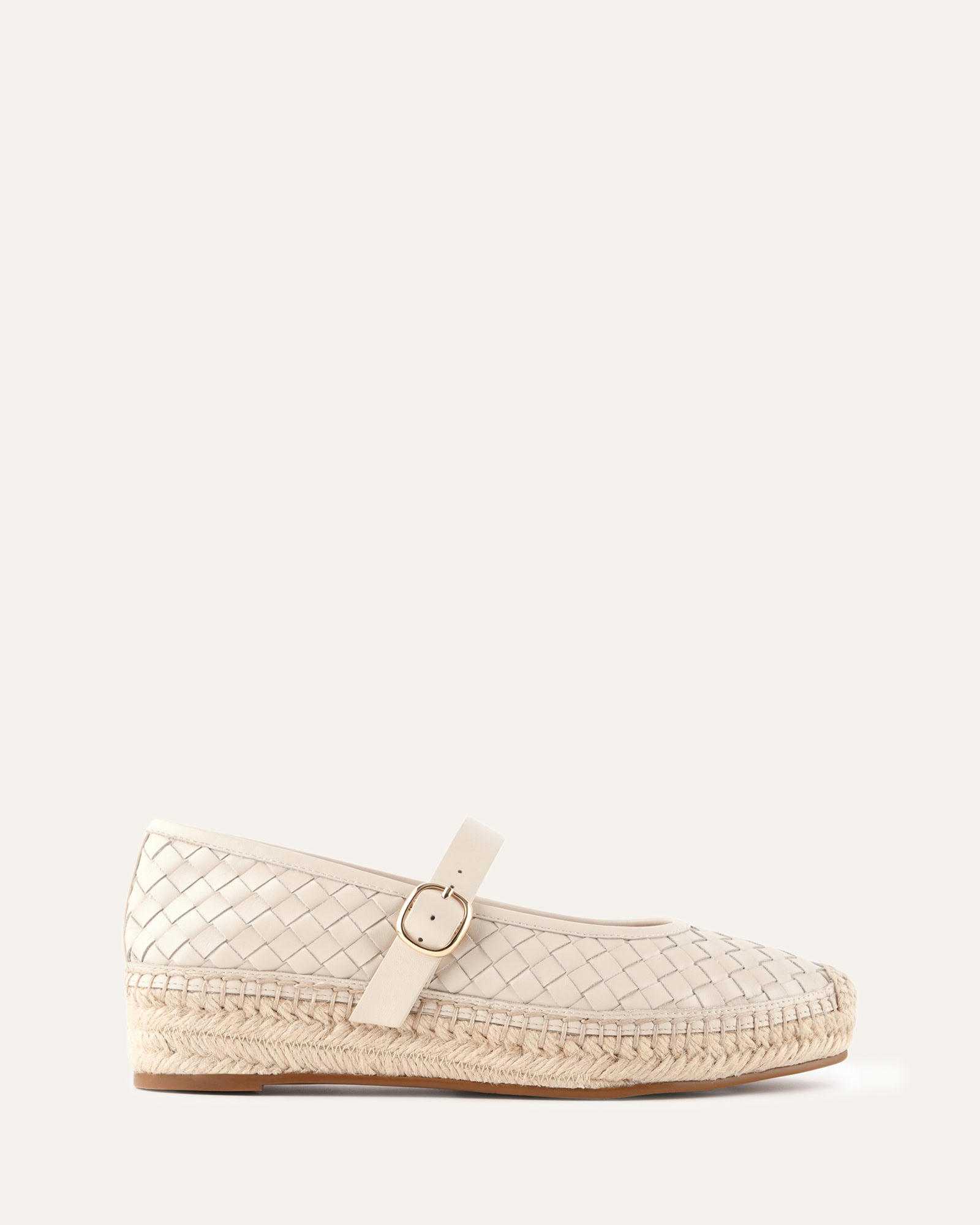 White woven shoe with a strap on a white background