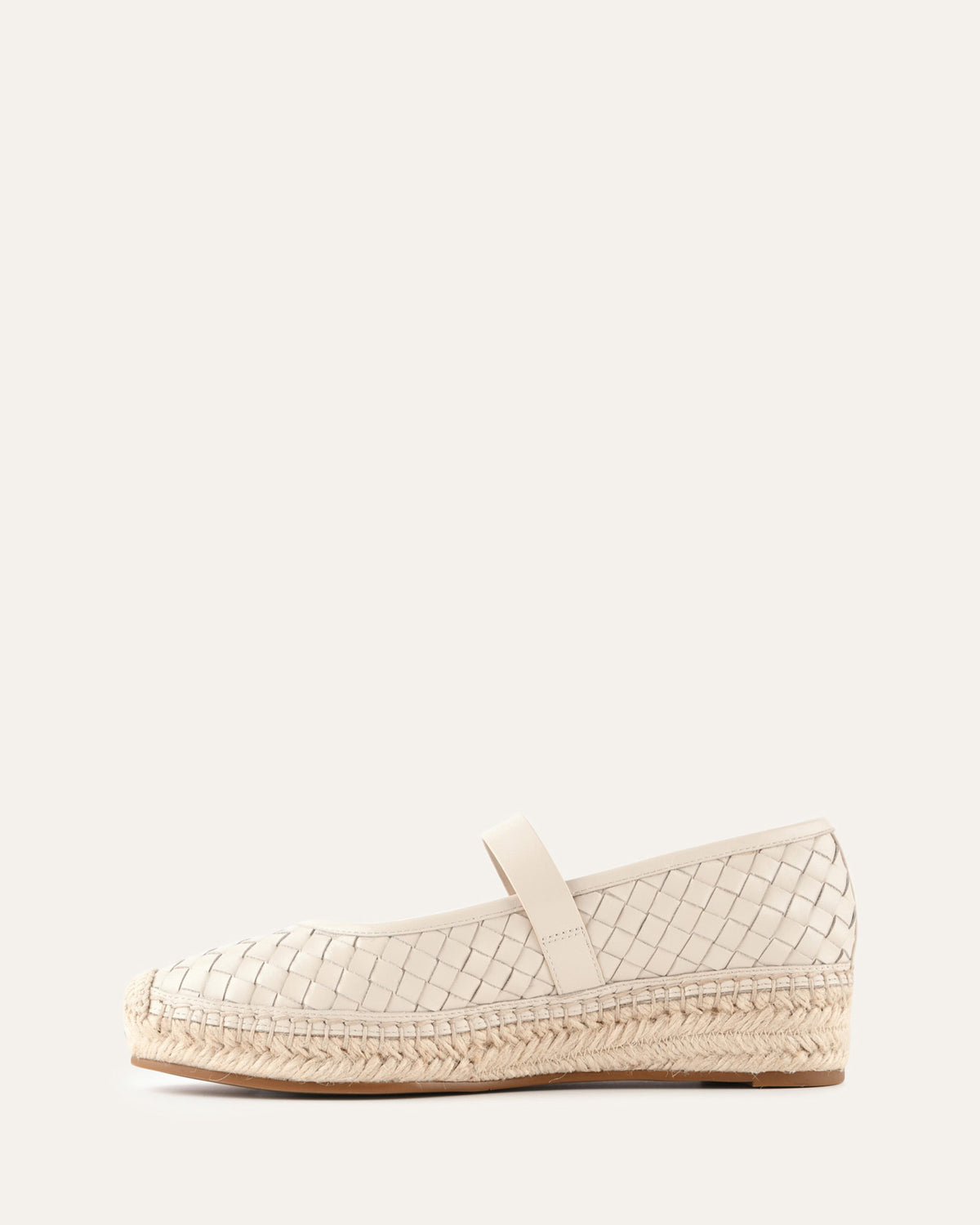 White woven wedge sandal on a white background