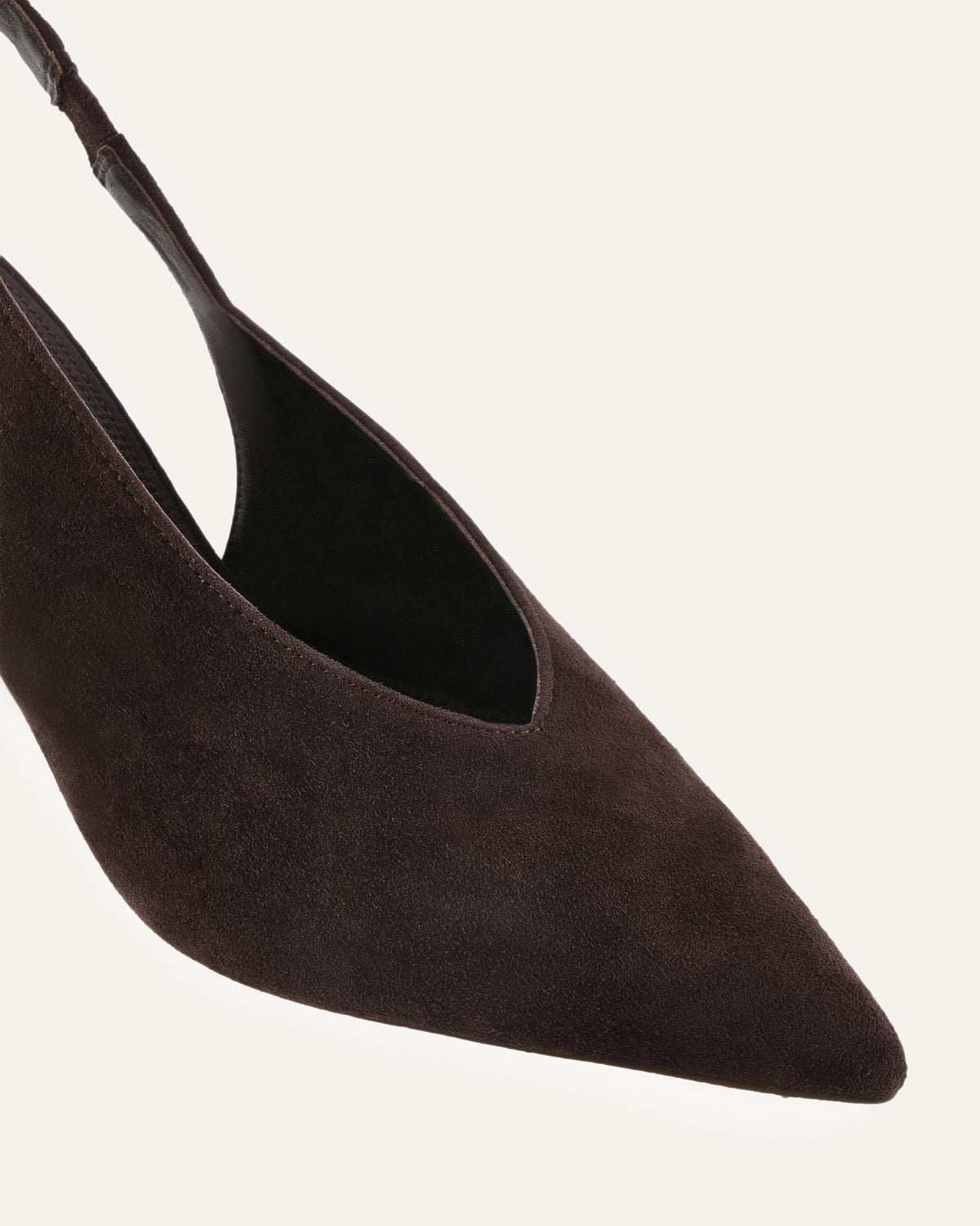Brown suede pointed-toe shoe on a light gray background