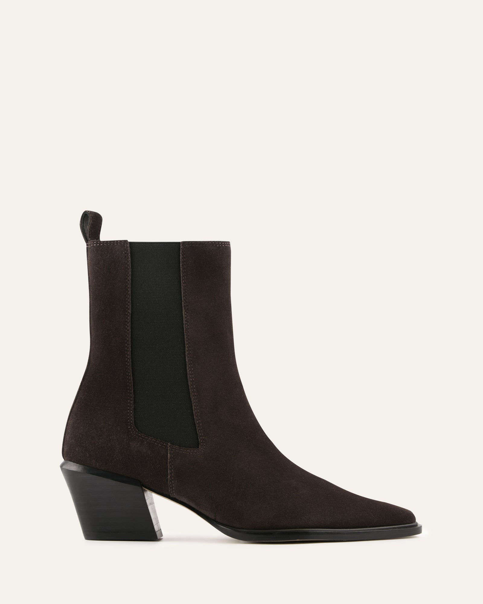Brown suede ankle boots with a black block heel on a light gray background