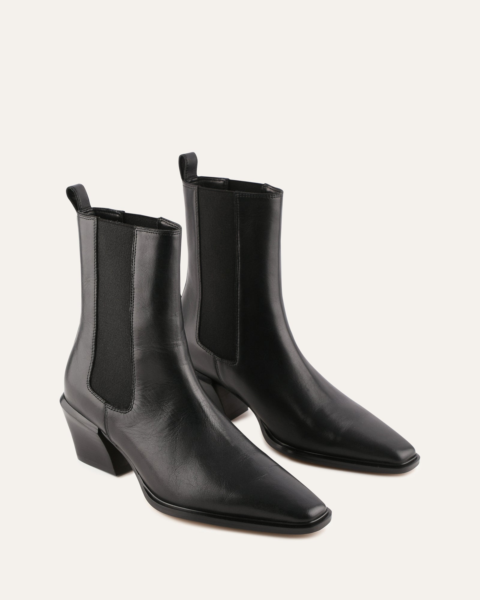 Black ankle boot on a light gray background