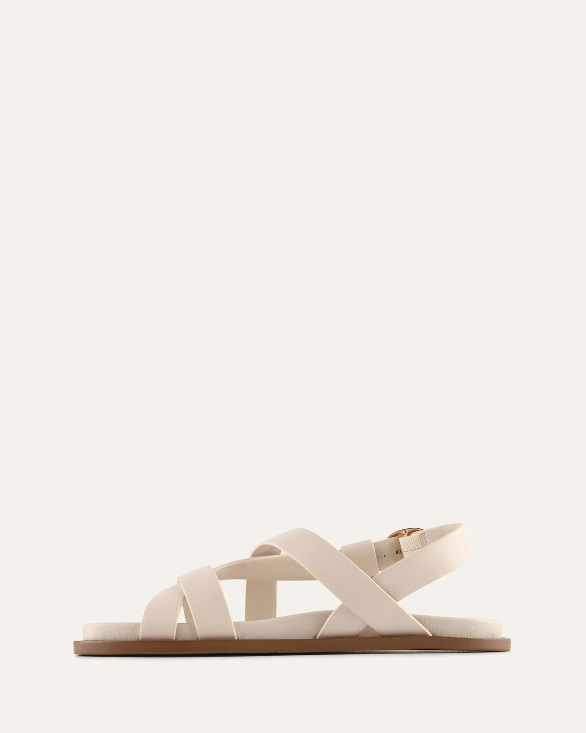 White sandal on a light beige background