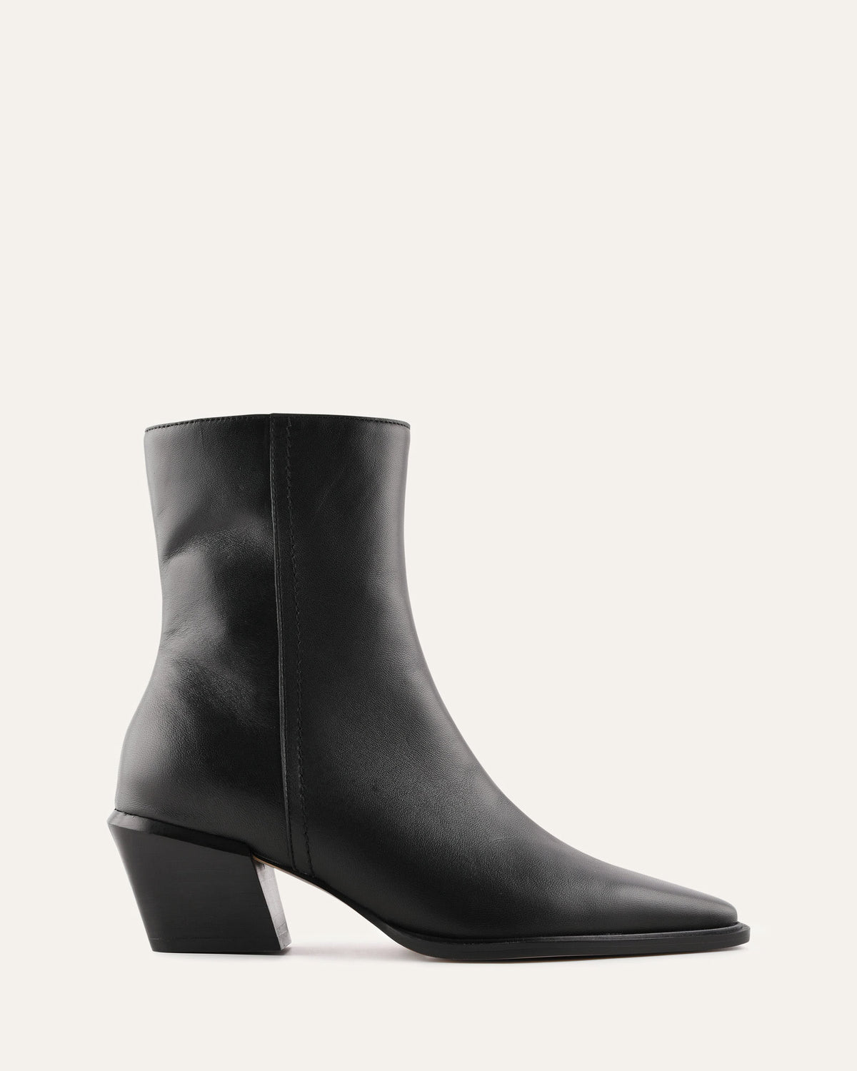 Black ankle boot on a light gray background